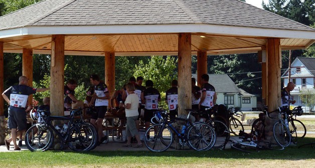 Cyclists rest under the shade of Arlington’s gazebo during the two-day RSVP ride