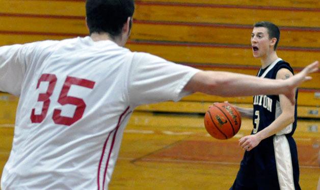 Eagles point guard Zach Cooper rotates the ball around M-P’s zone defense.