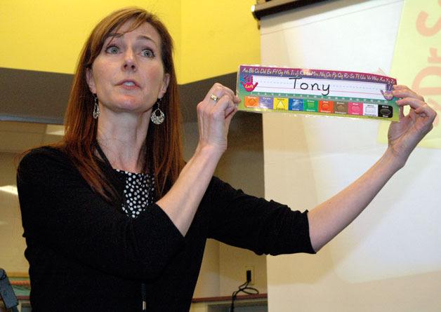 Eagle Creek Elementary Principal Kari Henderson-Burke shows one of the desk name tags designed to enhance kindergarten students’ literacy
