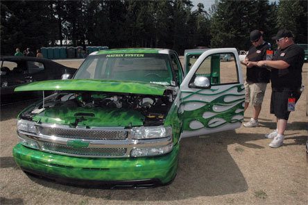 Brandon Knowles’ 2001 Chevrolet Silverado is judged at the 16th annual Sittin Pretti “Summer Slam” car show by Linc Boyington