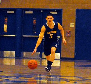 Arlington senior Gavin Smoke moves the offense down the court.