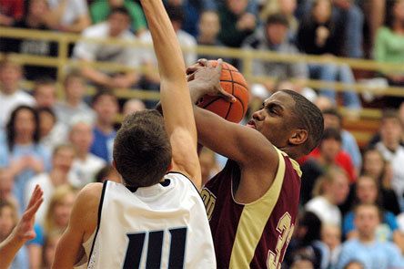 Junior guard Tre' Haslom battles traffic in the lane