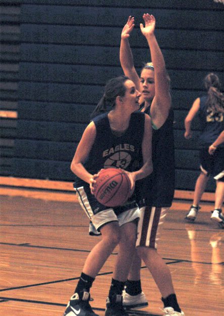 Senior Ginny Wilson backs down another Arlington player during a one-on-one practice drill.
