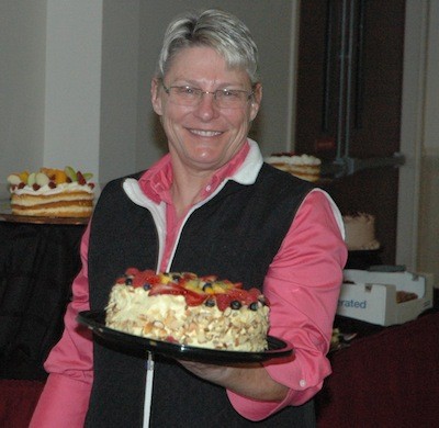 Ronda Hardcastle of the Marysville YMCA fetches a delectable dish during the dessert dash portion of the Village Community Services gala fundraiser on May 3.