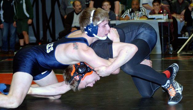 Arlington senior Scotty Bardell wrestles against a Central Kitsap opponent.