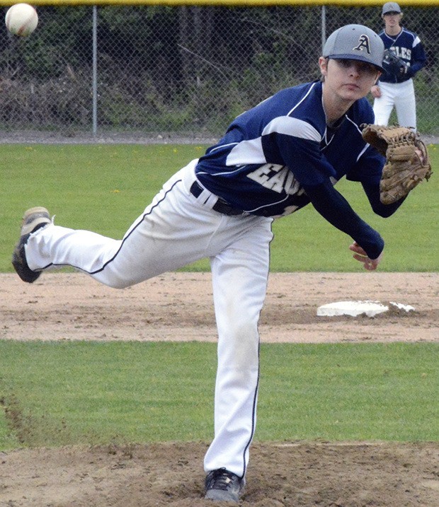 An Arlington player throws a pitch.