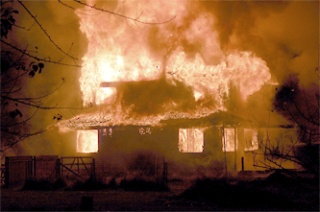 A fire engulfs a house on 19th Dr. NE at 11 p.m. Friday