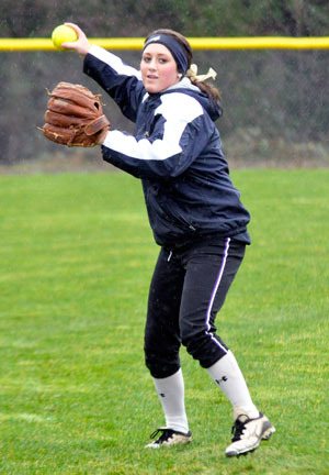 Arlington senior catcher Lynsey Amundsen practices throwing on the Eagles’ softball field during practice on Wednesday