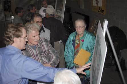 Brian Walsh of WSDOT speaks with concerned residents during a recent open house regarding a proposed roundabout at the SR 9/SR 531 intersection.