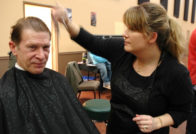 Ken Thompson gets a haircut from Kristen Close at the Smokey Point Community Church Jan. 28.
