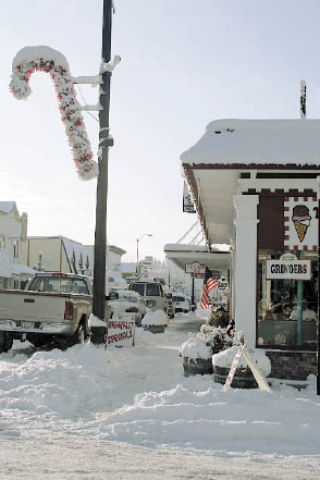 As snow settles on Olympic Avenue Friday