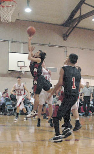 Tulalip’s Keith Davis finds a lane to the basket