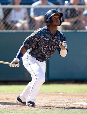 AquaSox’s Michael Faulkner gets a base hit at home. Top AquaSox players are heading to Britt Sports Cards in Arlington on Aug. 3 for an autograph signing.