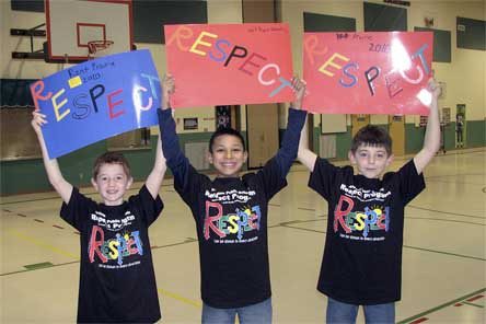 Students from Kent Prairie’s Respect Team display signs they made. Respect Team students and advisers led a “No Bullying” march on Jan. 15 in honor of Martin Luther King Jr.