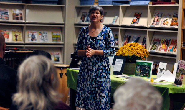 Arlington Library’s managing librarian Kathy Bullene speaks to a crowd at the Sno-Isle 50th anniversary celebration and open house on Saturday