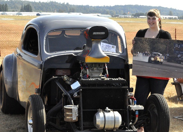 Rachel Brown showed off her father Joe Brown's 1940 Willys Coupe at last year's Drag Strip Reunion.