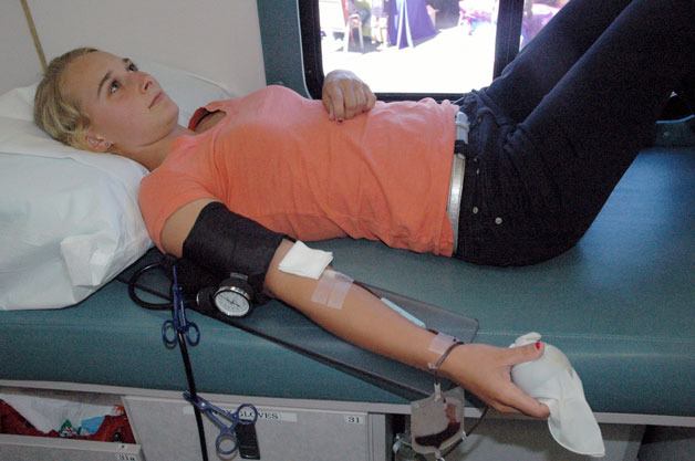 Arlingtonâ€™s Katelynn Kazen donates blood for the first time at the Puget Sound Blood Centerâ€™s Bloodmobile on July 18.