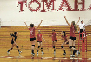 The M-P spikers celebrate their win over Snohomish. From left