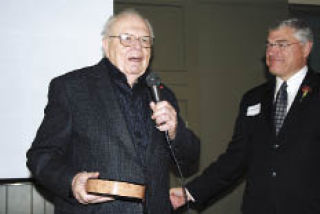 Dick Post accepts a Lifetime Achievement Award from Dale Duskin at the Stillaguamish Senior Center Nov. 12.