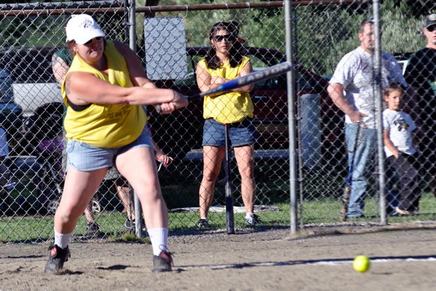 Krosswalk Krew’s Doris Young hits a ground ball during a coed softball game Wednesday