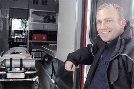 Paramedic firefighter Paul Hunsaker shows off the inside of an ambulance at the Arlington Fire Department Station 1 Wednesday