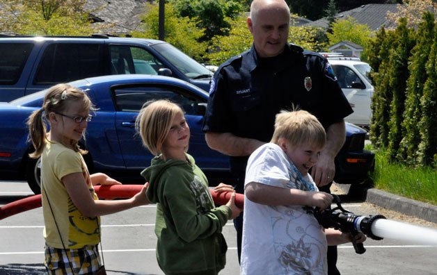 Fire Capt. Cary Stuart helps
