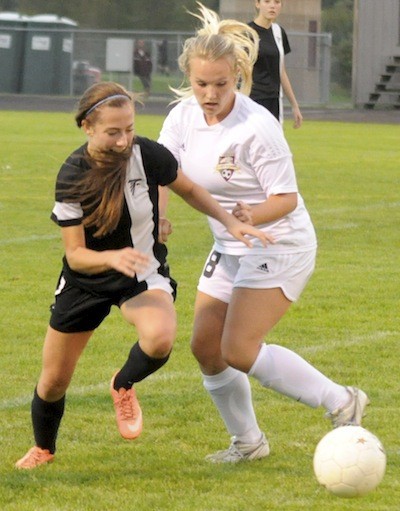 Lakewood's Bailey Nixon fights for possession from a South Whidbey player.