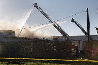 Arlington fire crews work to contain a fire at the National Foods Corporation plant Nov. 10.