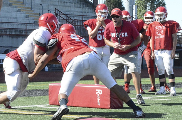By Brandon Adam/Staff PhotoMarysville-Pilchuck coach Brandon Carson likes what he sees during a tackling drill.