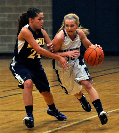 Arlington senior Winter Brown dribbles down court during a home game against Mariner High School on Wednesday
