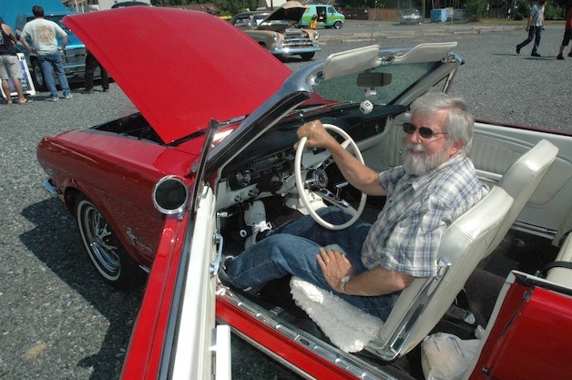 Arlington's Bob Kreucher shows off his 1965 Ford Mustang convertible at the Faith Lutheran Church of Lakewood's Hot August Car Show on Aug. 10.