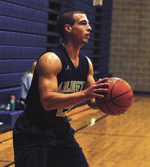 Arlington senior guard Brady Brummel participates in a passing drill.