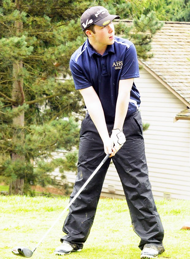 Arlington golfer Austin Faux looks on before he tees off.
