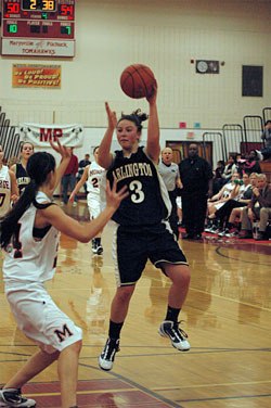 Sophomore guard Megan Abdo drives to the hoop and passes to a teammate on the break.
