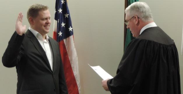 Ken Klein is sworn in to the Snohomish County Council by Superior Court Judge Joseph Wilson on Jan. 6.