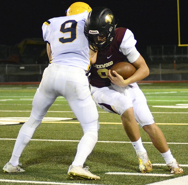 Brandon Adam/Staff PhotoLakewood’s Austin Lane lowers his shoulder into a South Delta defender.