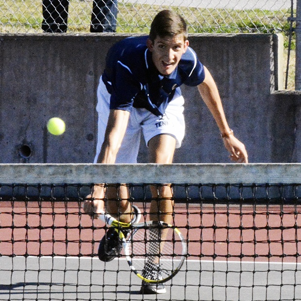 Connor Gutherie of Arlington keeps the ball in play.