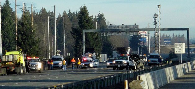 Crews work to clear the site of a Feb. 18 fatal accident on I-5. The multi-vehilce accident