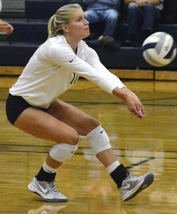 Brandon Adam/Staff PhotoAn Arlington volleyball player bumps the ball.