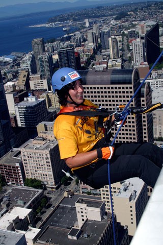 Arlington resident Sandy Catiis makes her way down the Rainier Tower in Seattle on Saturday