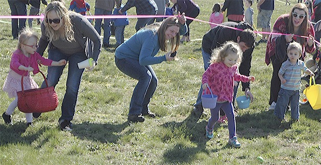 Kids take off at the start of the Easter Egg Hunt at the Arlington Airport Saturday.