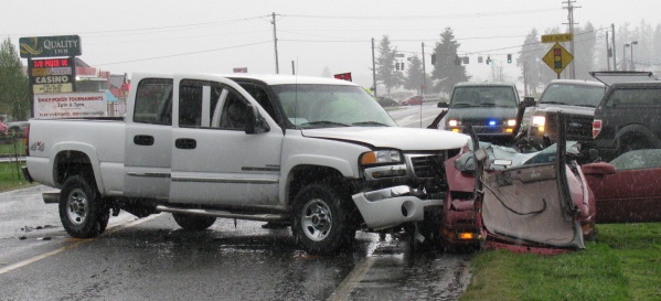The aftermath of a head-on collision between a 2006 GMC three-quarter-ton pickup and a 1992 Ford Probe in the 5200 block of 172nd Street NE on April 30.