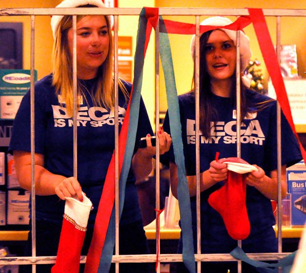 Arlington High School DECA students Elizabeth Roth