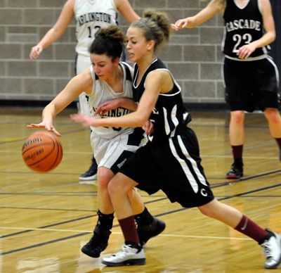 Arlington senior guard Megan Abdo contends for a loose ball against Cascade sophomore guard Natalie Watson on Jan. 21.