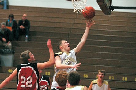 Senior Jacob VonPein finishes a fastbreak during the first quarter.