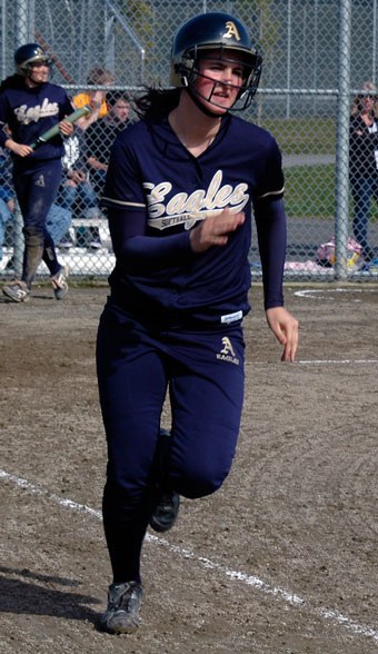 Arlington’s Veronica Ladines heads to first base