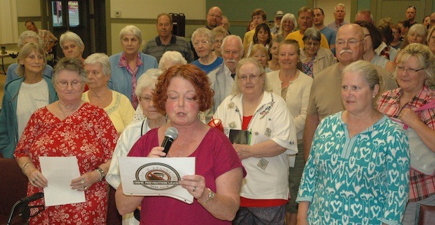 Attendees of the Stillaguamish Senior Center's community crime prevention meeting Aug. 6 pledge on video that they're 'All In' for Arlington's five-pronged approach to fighting crime.