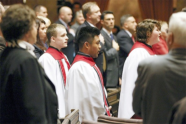JJ Valencia and the rest of the Marysville-Pilchuck High School choir sings the national anthem amid the state's lawmakers during the governor's State of the State address Jan. 13.