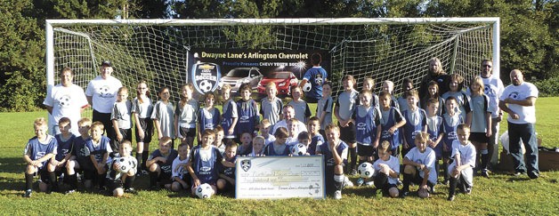 Teams from North Sound Soccer Club don new shirts and practice gear from Dwayne Lane’s Arlington Chevrolet
