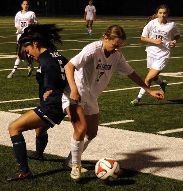 Alison Enell of Arlington wins possession of the ball.
